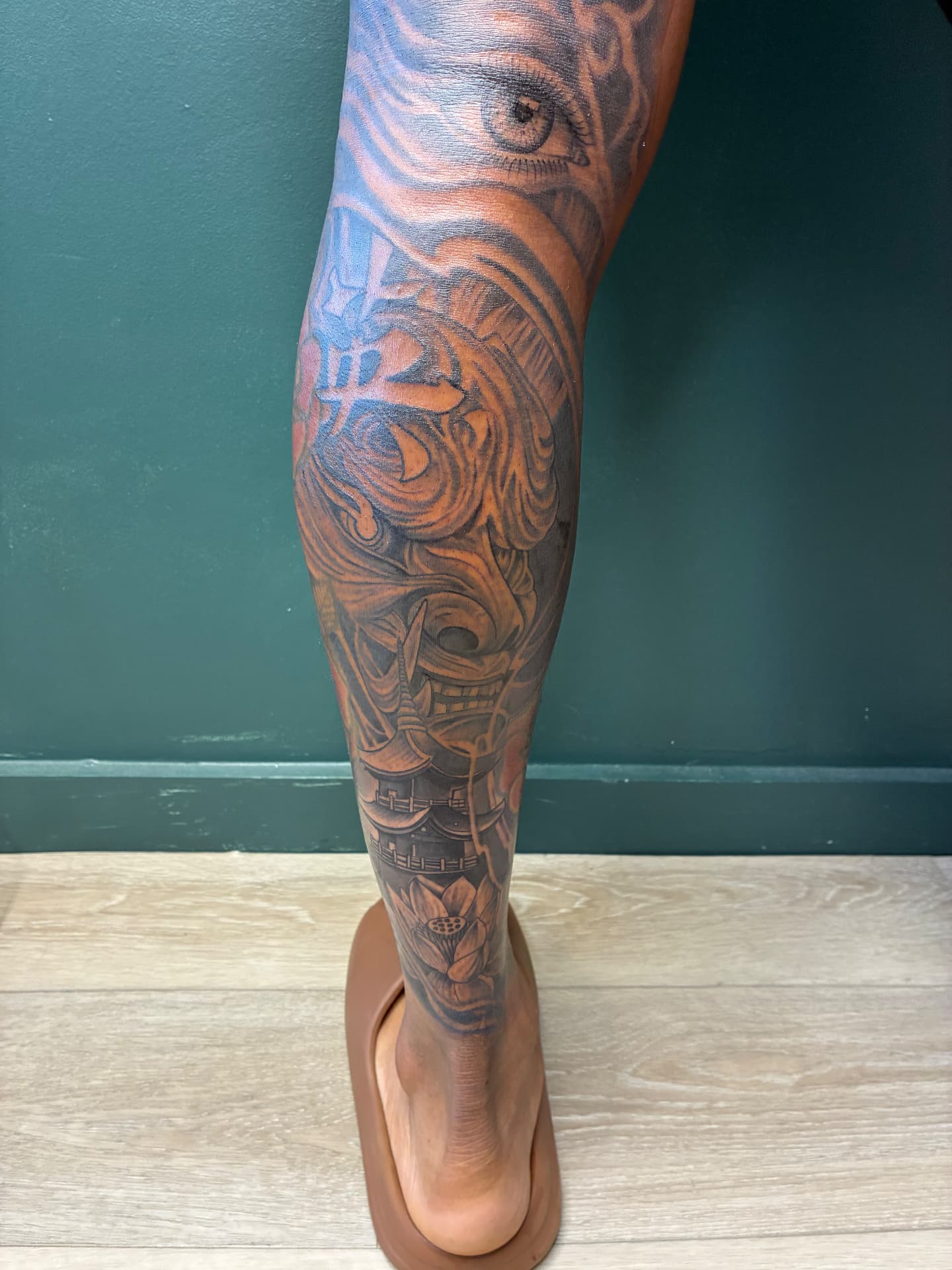 Japanese hannya and pagoda leg sleeve tattoo