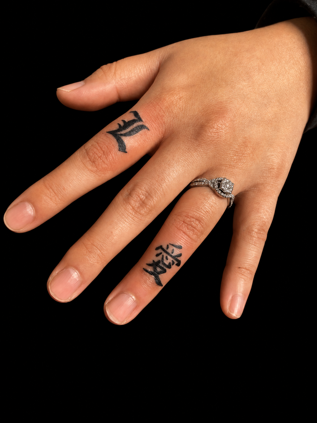 Fine-line script finger tattoos
