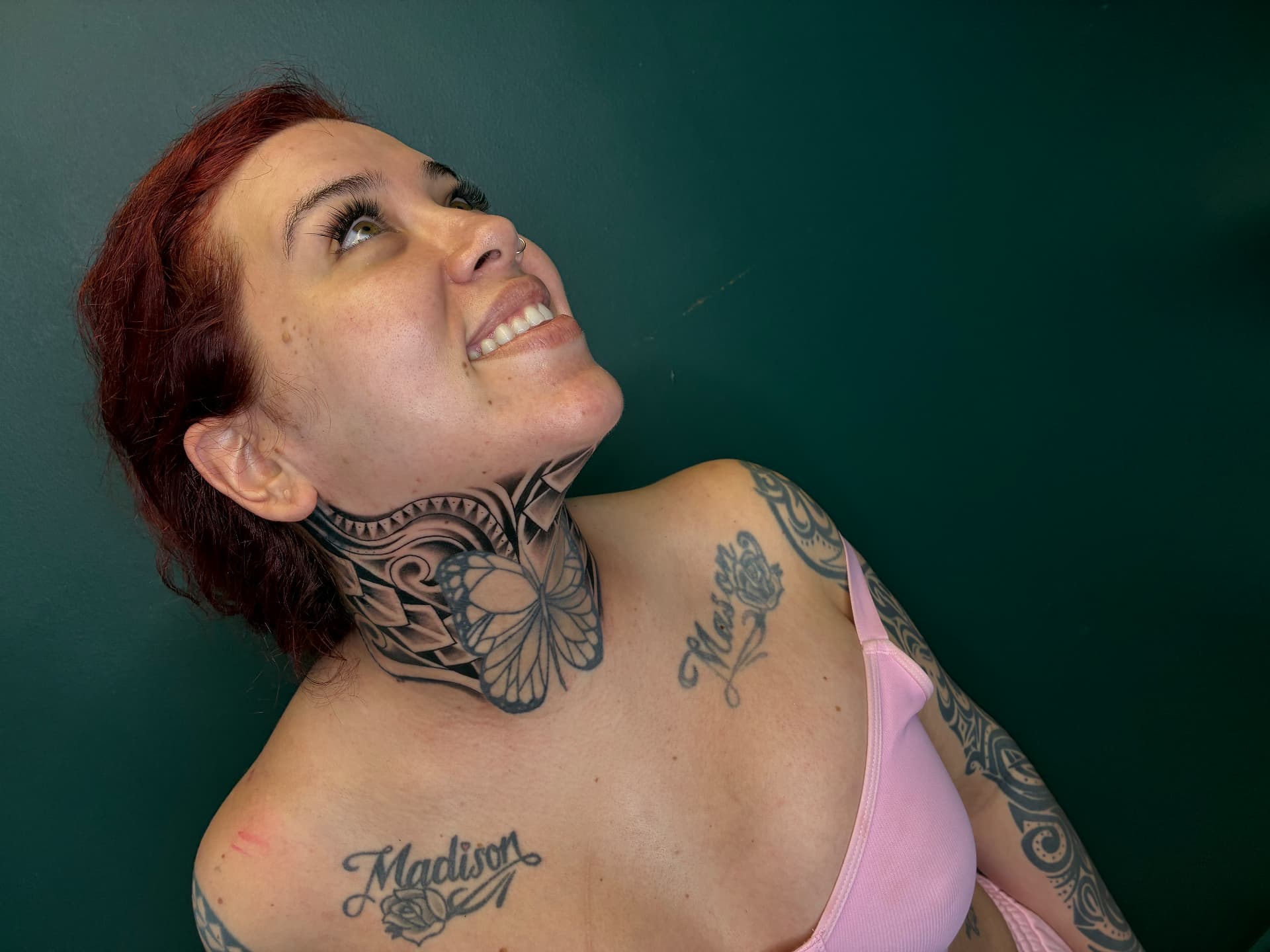 Ornamental butterfly and mandala neck tattoo